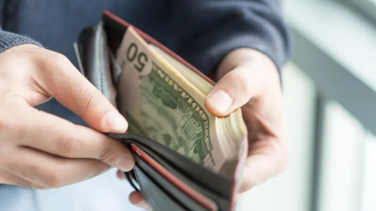 Judge Strikes Down Biden Administration's Minimum Wage for Federal  Contractors in Some States