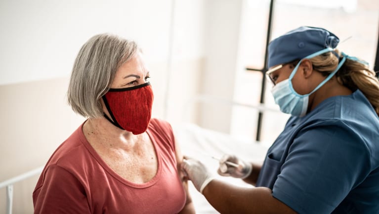 a woman getting vaccinated
