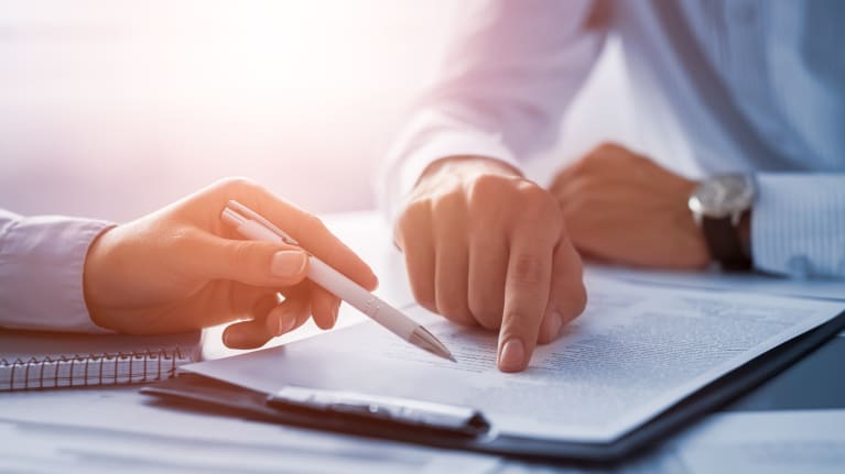 business people reviewing contract