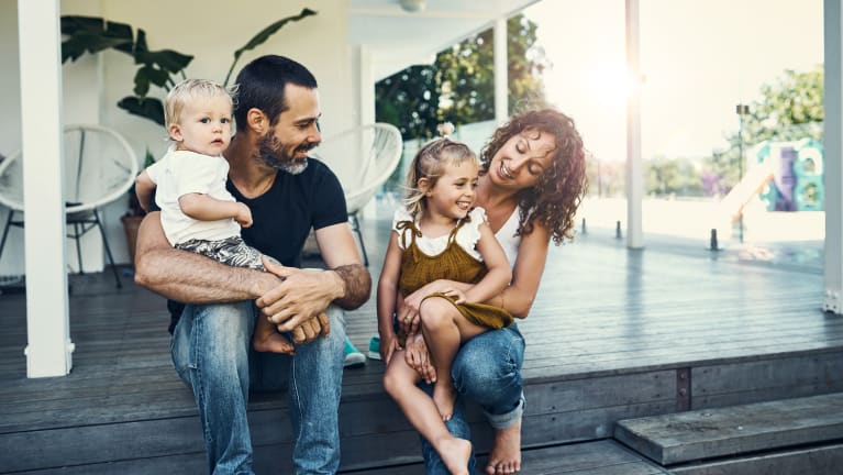 family sitting on porch