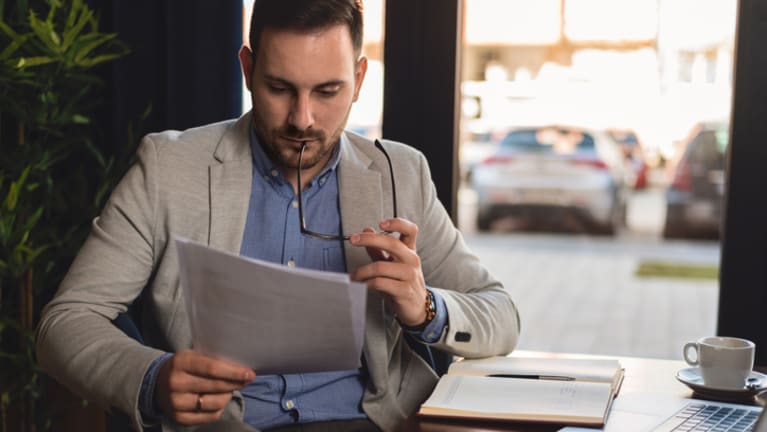 man reading file
