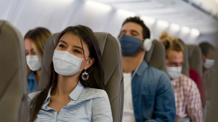 masked airline passengers