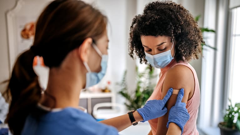 woman receiving vaccine 