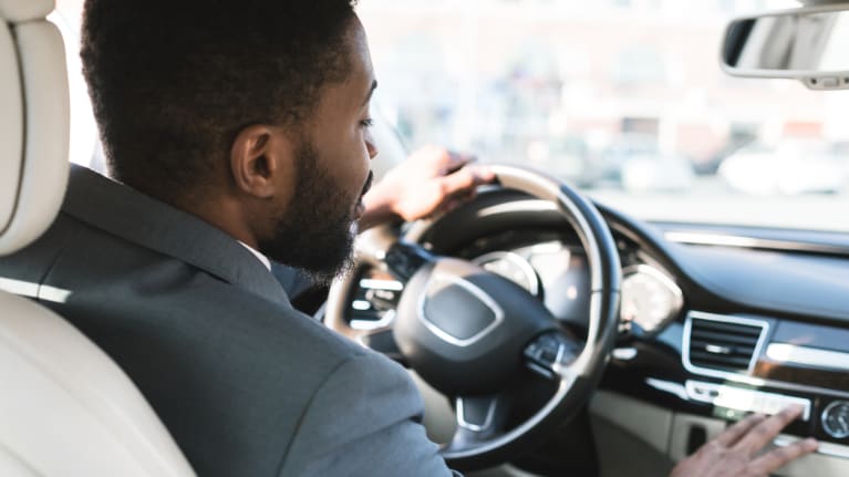 Businessman driving car