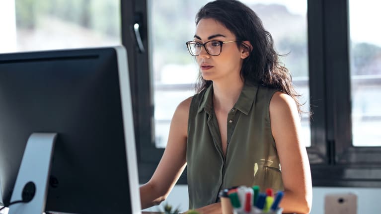 A professional at her computer