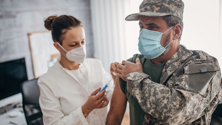 Military soldier getting COVID-19 vaccine