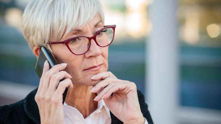 an older businesswoman on her cellphone