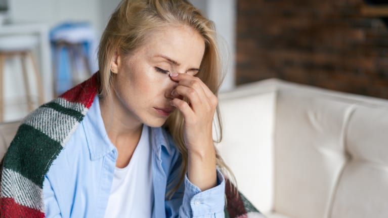 person with cold symptoms