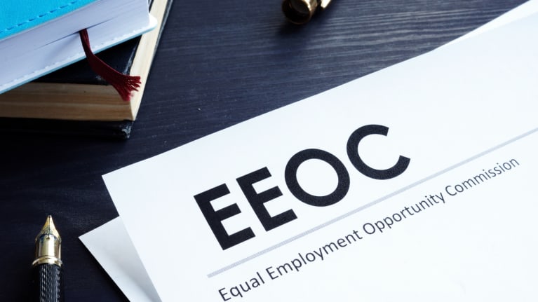 Equal Employment Opportunity Commission letterhead and a pen