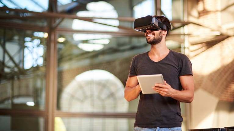 Man using virtual reality simulator headset