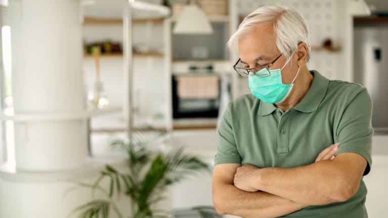 man with facemask at home