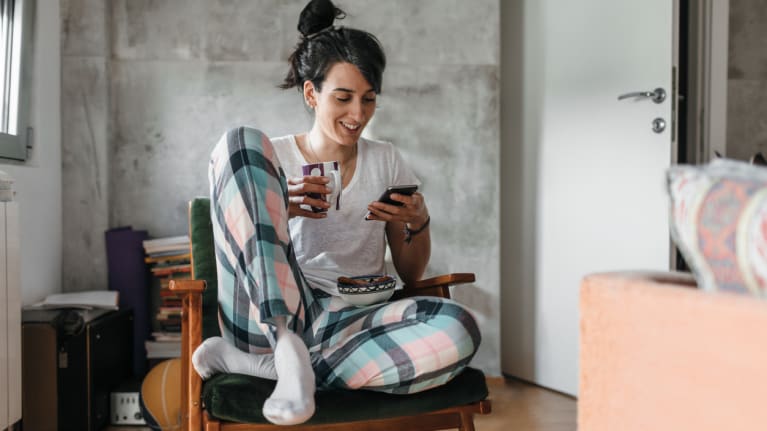 woman on phone in pajamas