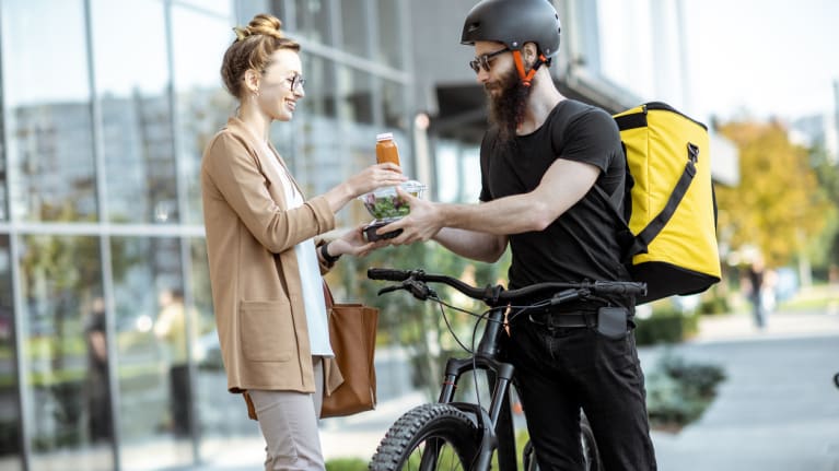gig driver on bicycle delivering food