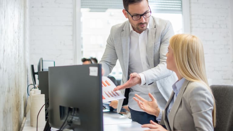 office workers arguing over documents