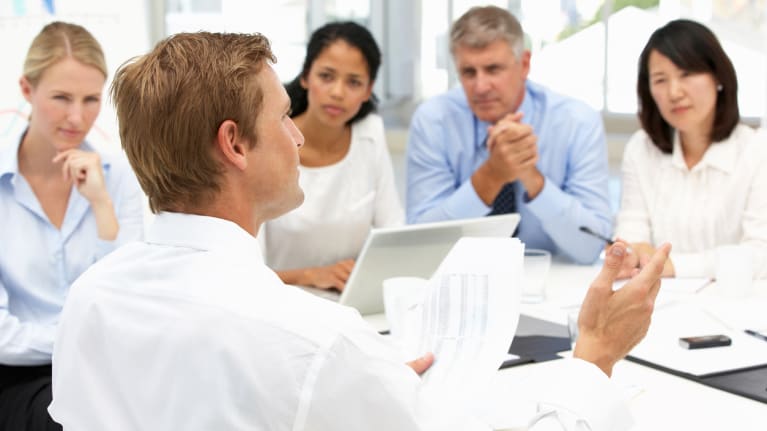 meeting of five business professionals