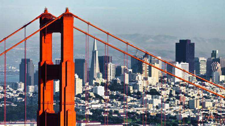 The Golden Gate Bridge and San Francisco skyline behind it