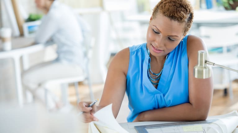 businesswoman reviewing plans