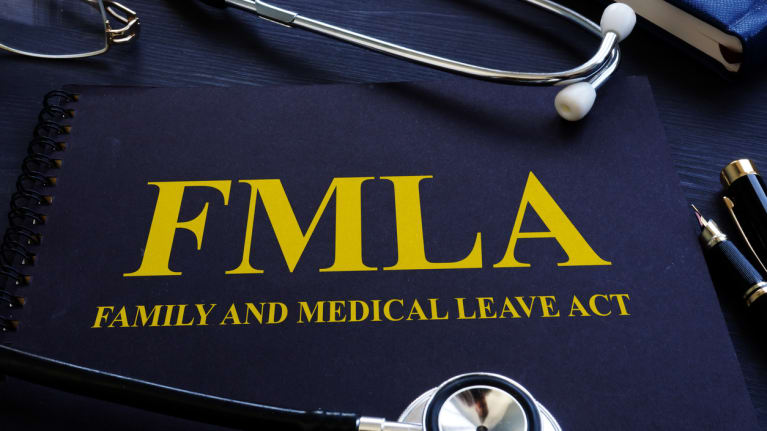 FMLA handbook with stethoscope