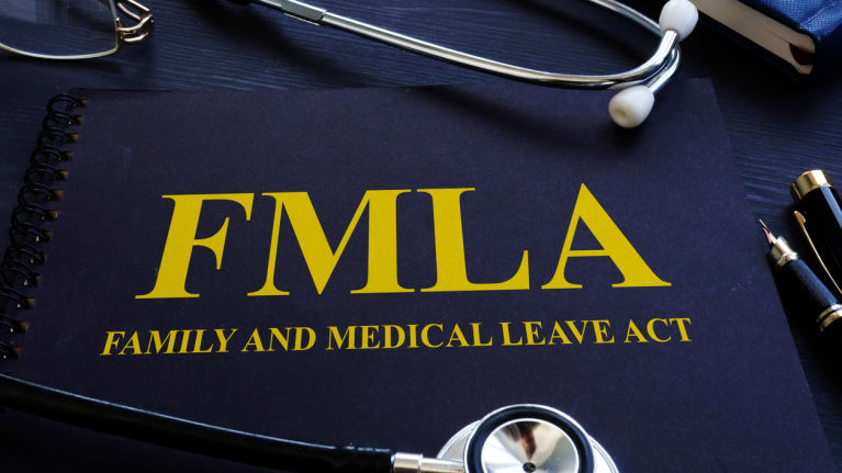 An FMLA handbook and stethoscope