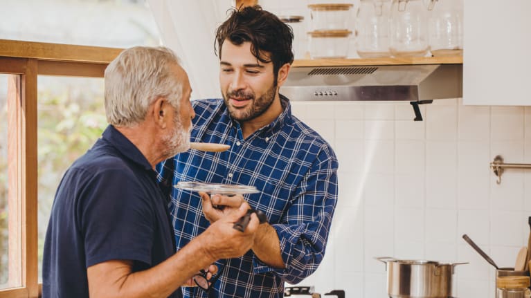 grandson helping grandfather