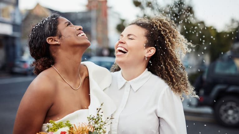 two women getting married outside
