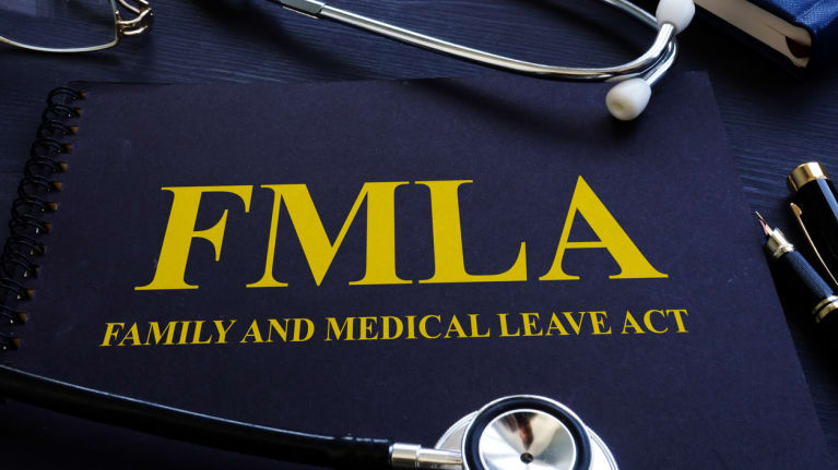 A stethoscope and FMLA handbook