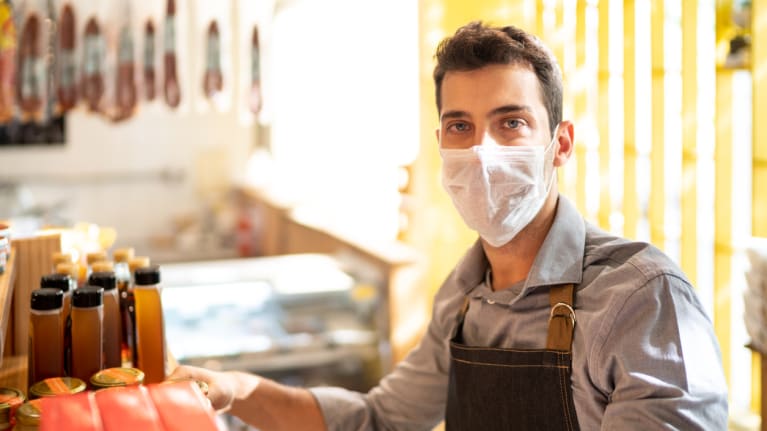 Shop employee wearing mask
