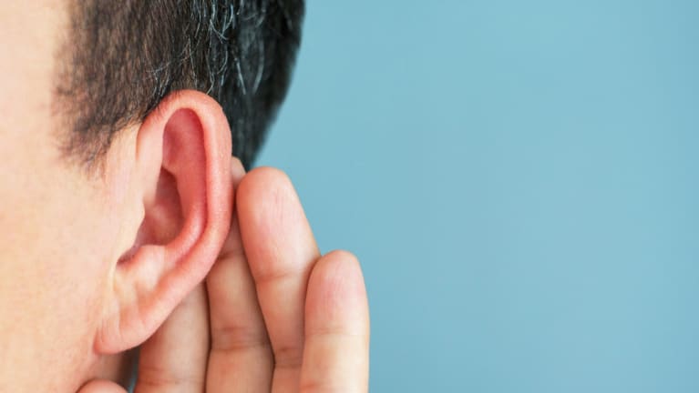 person touching ear