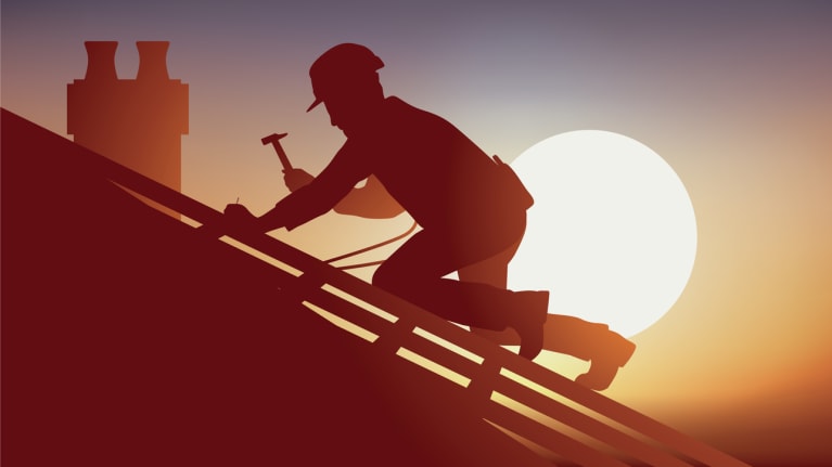 a construction employee working on a roof in the heat