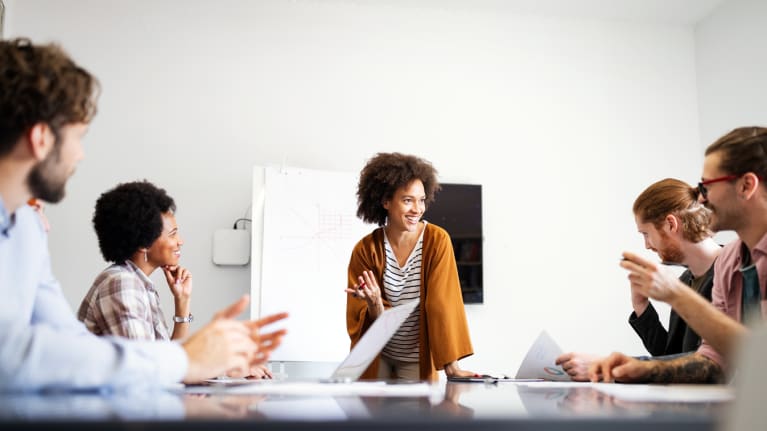 diverse group of employees meeting in a conference room