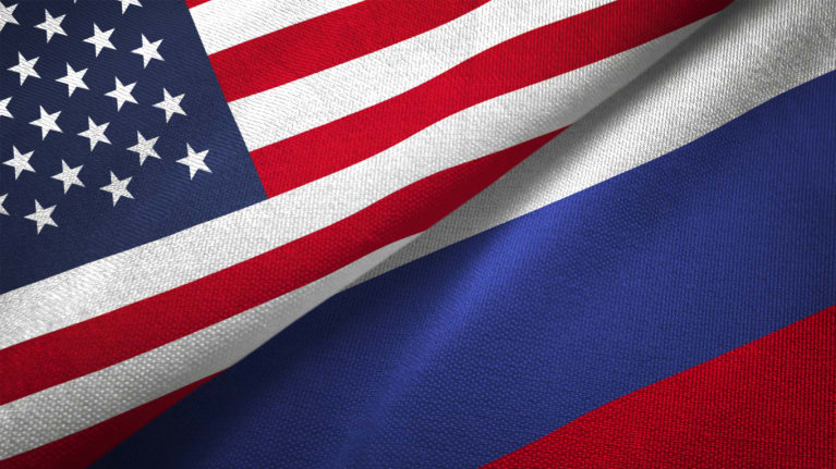 American and Russian flags side by side at a diagonal