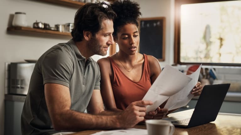 A couple going over their financial statements.
