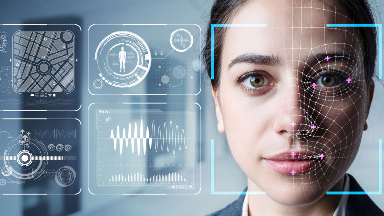 A woman&#39;s face with graphics of tehnology throughout the image