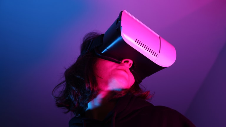 A woman wearing VR glasses
