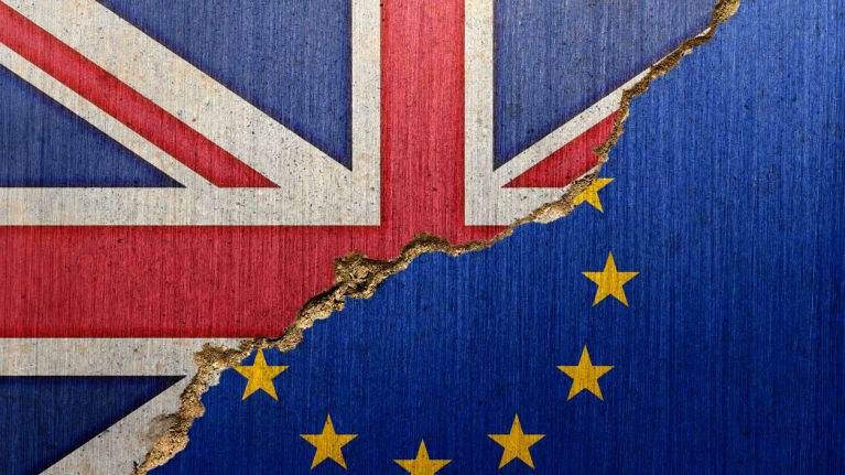 Half U.K. and half EU flags spliit down the middle diagonally